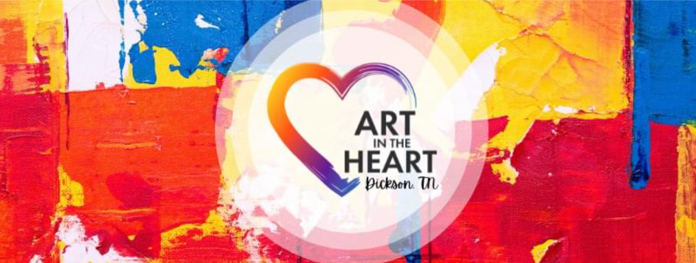 Colorful abstract art background featuring bright reds, yellows, and blues with the text 'ART IN THE HEART Dickson, TN' in a circular design.